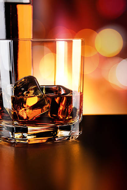 istock Whisky glass and bottle on the bar 636351730