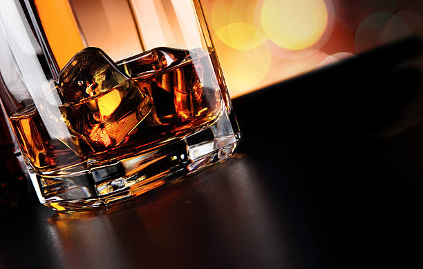 istock Whisky glass and bottle on the bar 636351750