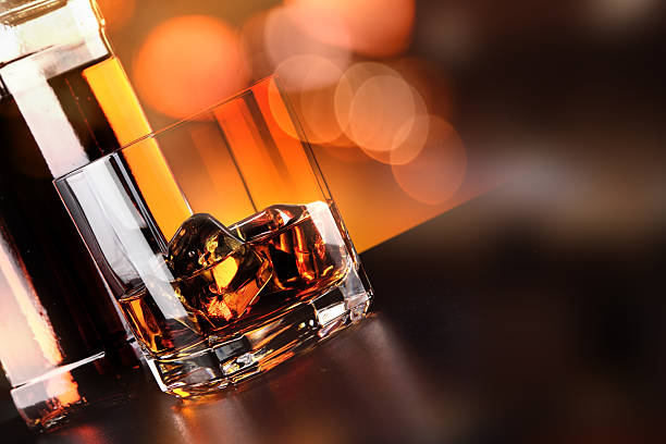 istock Whisky glass and bottle on the bar 636351788
