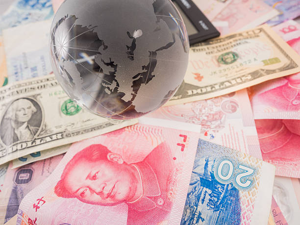 istock calculator and paper currency,globe 636353844