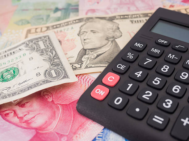 istock calculator and paper currency 636354000