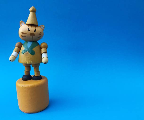 Cute cat wood toy on blue background