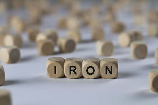 iron - cube with letters, sign with wooden cubes