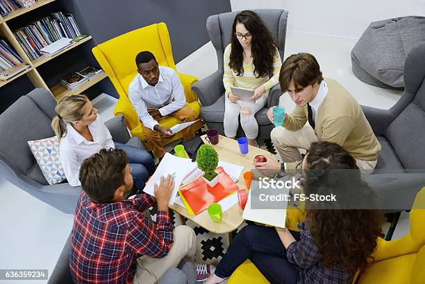 Young Team Of Freelancers Searching Information Making Business Tasks Consulting Stock Photo - Download Image Now