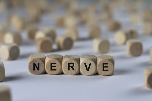 nerve - cube with letters, sign with wooden cubes