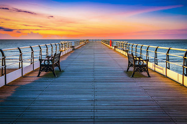 Sunset pier at Saltburn by the Sea, North Yorkshire, UK Sunset pier at Saltburn by the Sea, North Yorkshire, UK cleveland england stock pictures, royalty-free photos & images