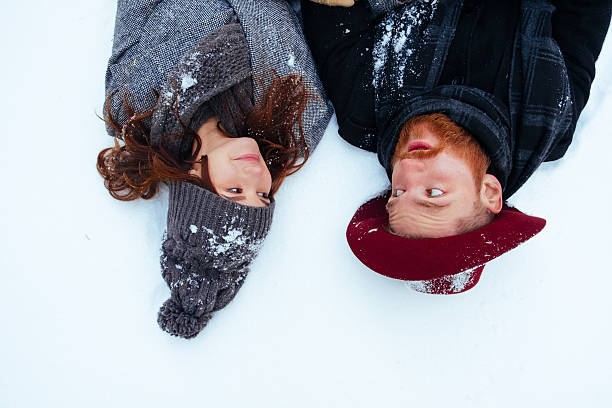 istock Winter weekend, couple in love having fun on snow in 636361426
