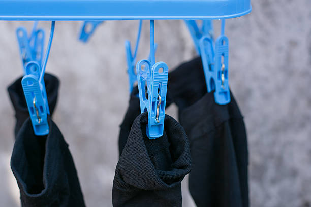 istock Clothes pegs or clothespins hang on a cord 636362194