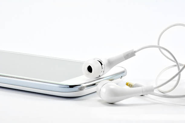istock The white smart-phone and white earphones isolate. 636362588