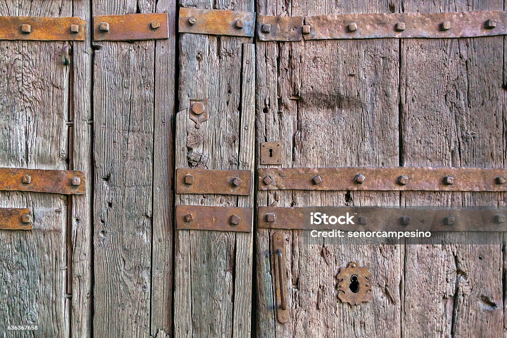 Old door Historical old wooden door in Trujillo (Extremadura, Spain). Architectural Feature Stock Photo