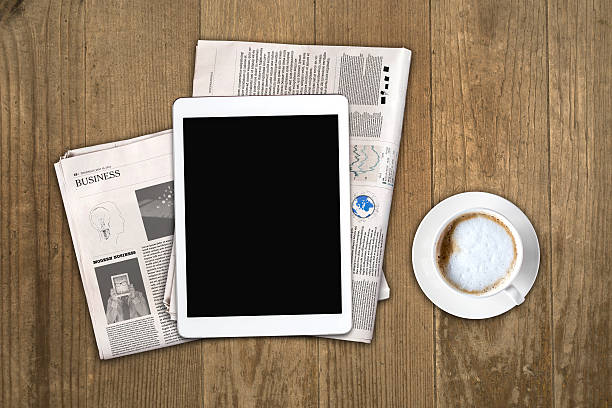 istock Daily newspaper, coffee and tablet with a blank screen. 636367848