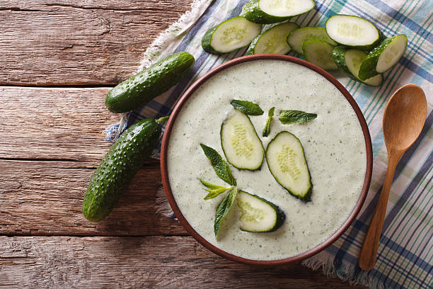 istock Cold cucumber soup with mint and yogurt close-up. Horizontal 636367864