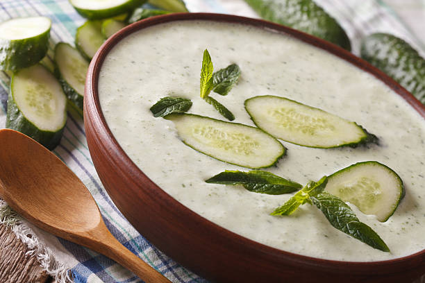 istock Fresh diet cucumber cream soup with mint closeup 636368408
