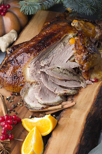 istock Total roast duck chopped into pieces, festive table 636369156