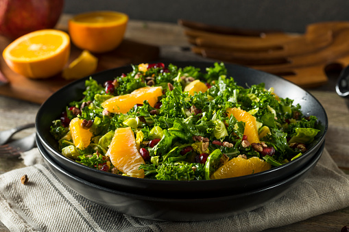 Raw Healthy Kale Winter Salad with Oranges and Pomegranate Seeds