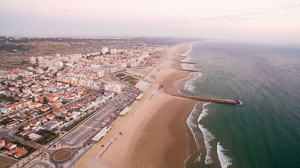 istock Panorama of Costa Caparica beach at evening aerial view 636370954