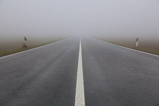 istock Straight road in the fog 636371024
