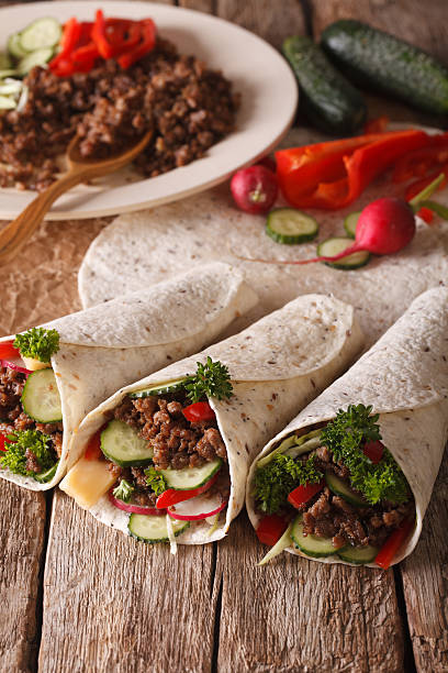istock Tortilla Roll with beef and vegetables close-up and ingredients. 636372208