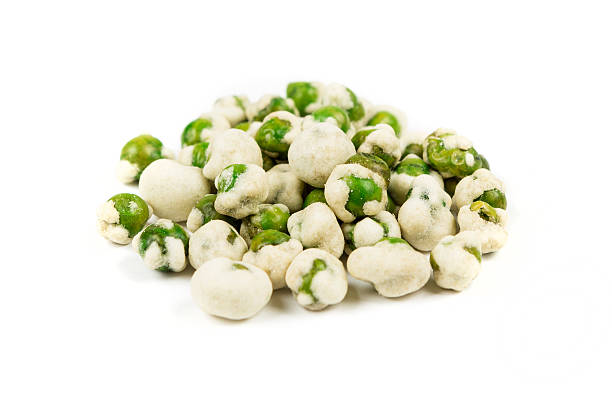istock Wasabi peas isolated on white background 636372276
