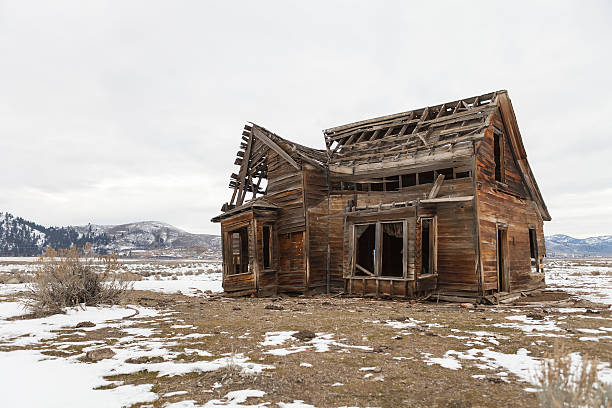 istock Old abandoned farm house in winter with snow. 636372748