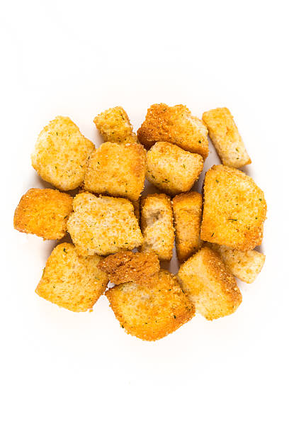 istock Garlic croutons isolated on white background 636372846