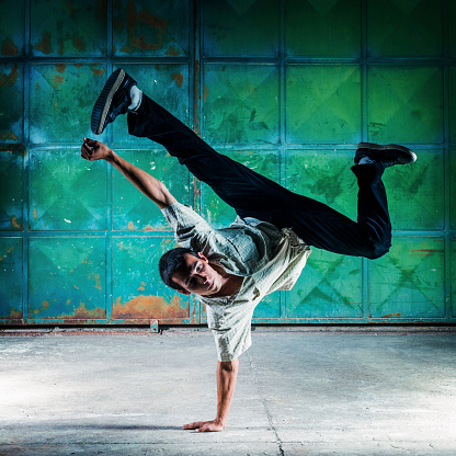 Breakdancer dancing. About 25 years old, Caucasian male.