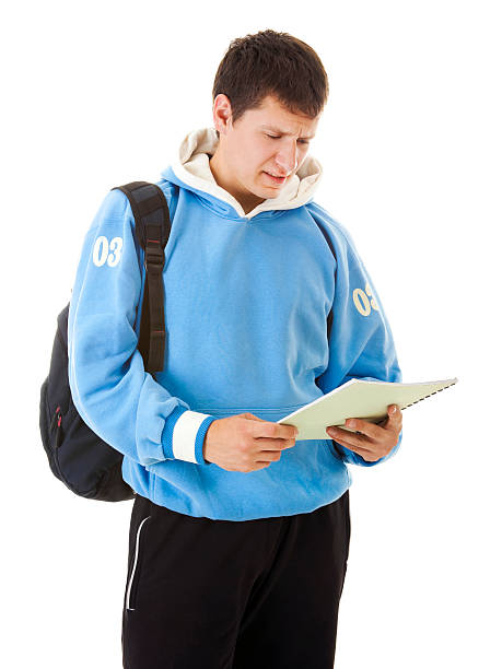 schüler liest seine reportkarte - backpack student report card education stock-fotos und bilder