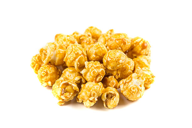 istock Pile of caramel popcorn isolated on white background 636377712
