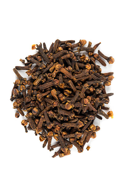 istock Pile of whole cloves isolated on white background 636377758