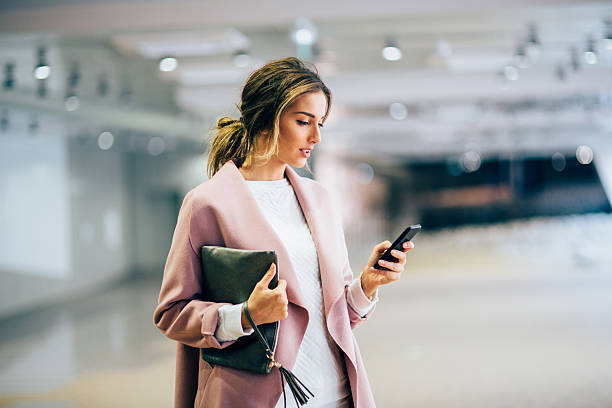 istock Beautiful woman texting 636377844