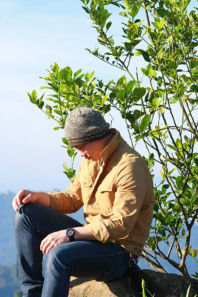 istock young man enjoy the view at mountain 636377928