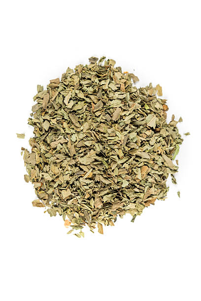 istock Pile of basil isolated on white background 636378466