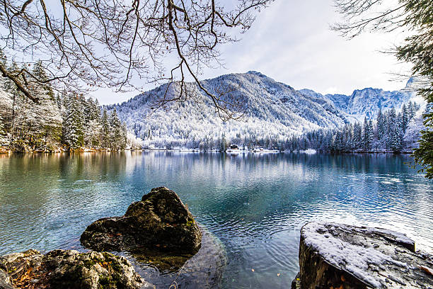 istock first snow at the mountain lake 636378470