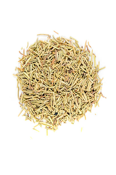 istock Pile of rosemary herb isolated on white background 636378490
