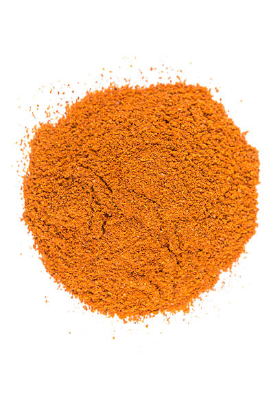 istock Pile of cayenne pepper isolated on white background 636378750