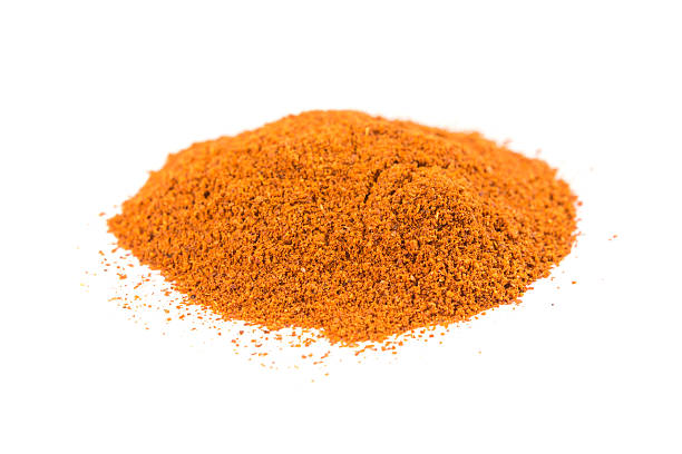istock Pile of cayenne pepper isolated on white background 636378774
