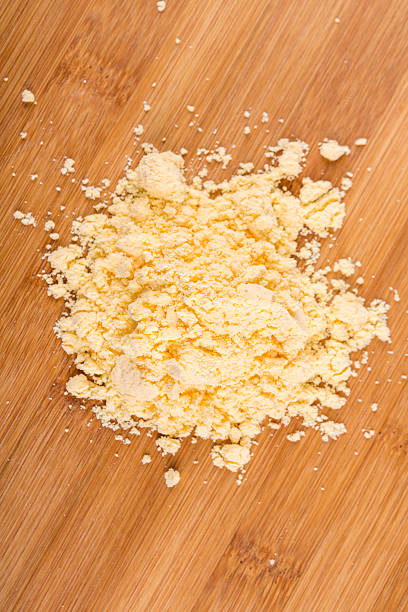 istock Cheese powder mix isolated on wood background 636379046