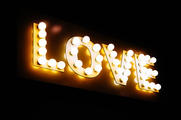 istock Love word made of glowing light bulbs. 636379164