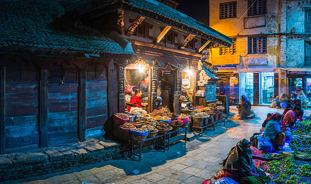 kathmandu warmly illuminated night market spice sellers durbar square nepal - nepalese culture nepal kathmandu bagmati imagens e fotografias de stock