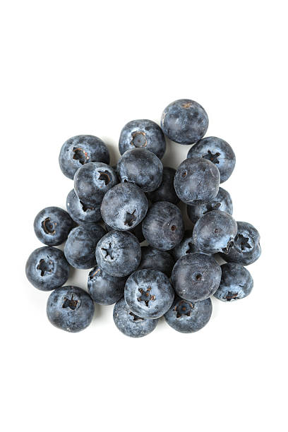 istock Pile of blueberries isolated on white background 636383628