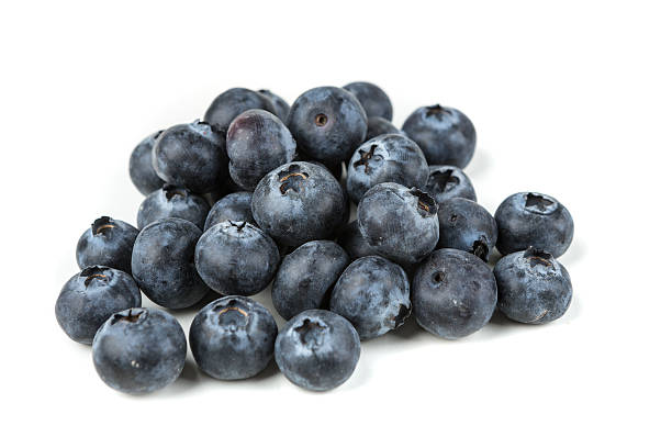 istock Pile of blueberries isolated on white background 636383650