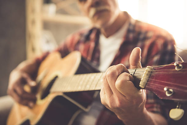 istock Handsome mature man with guitar 636384938