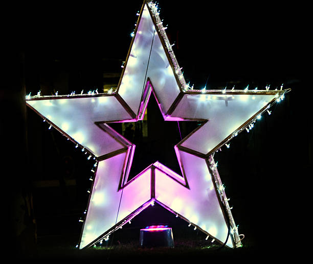 istock Colored Christmas star lights and ornaments 636385156