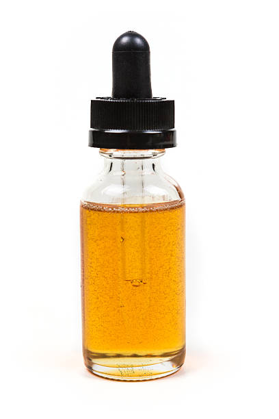 istock Flavored vape juice isolated on white background 636385276