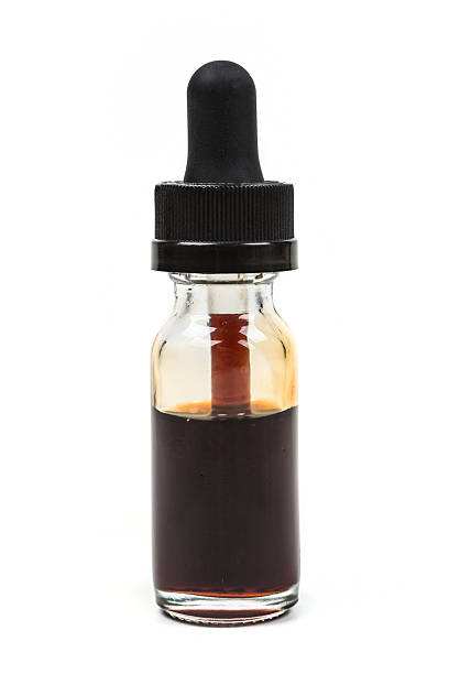 istock Expired discolored vape juice isolated on white background 636385312