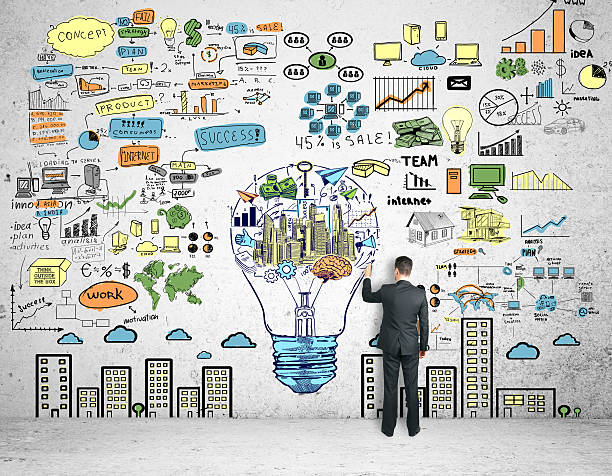 istock Man drawing business sketch 636387352