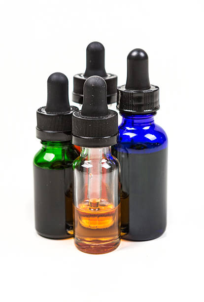 istock Flavored vape juice isolated on white background 636387534