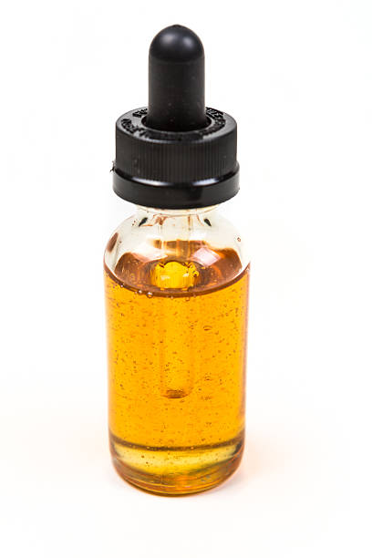 istock Flavored vape juice isolated on white background 636387614