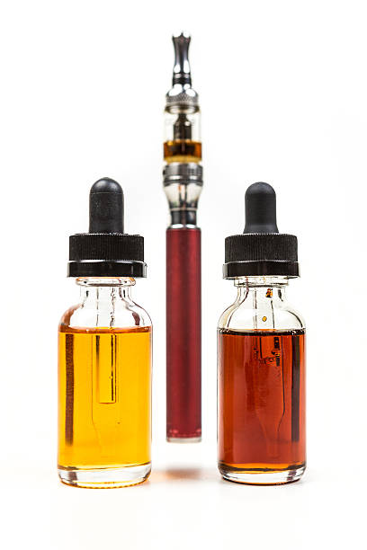 istock Assorted flavors of vape juice and an ecigarette 636387934