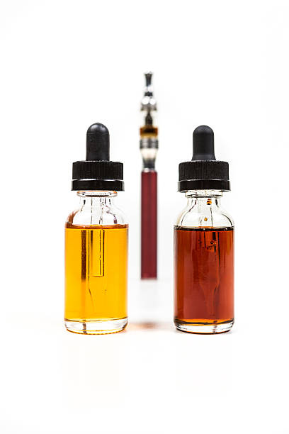 istock Assorted flavors of vape juice and an ecigarette 636387952